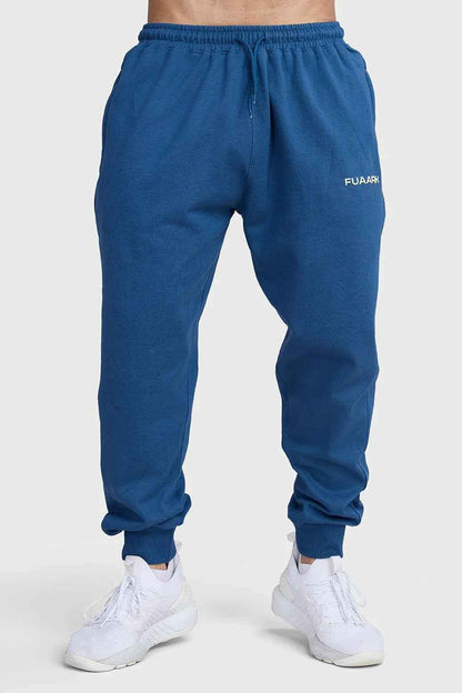Navy Signature Oversized Joggers by Fuaark Nz, made from soft fabric, featuring a relaxed fit and elastic waistband.