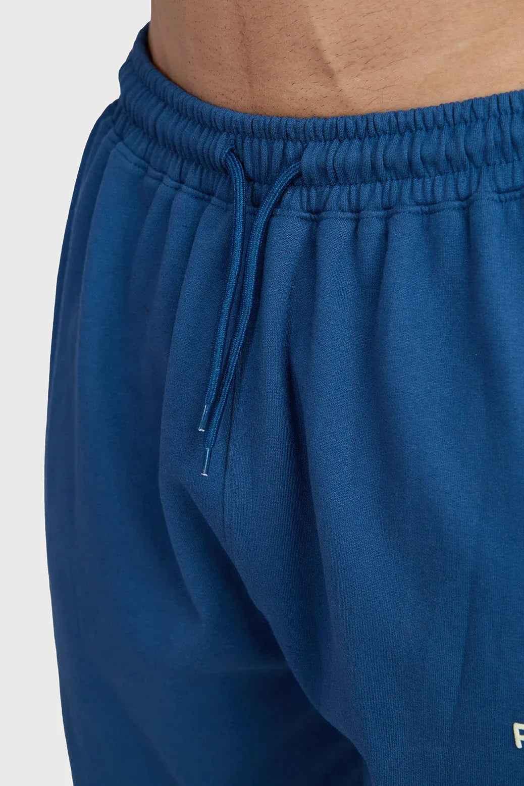 Navy signature oversized joggers from Fuaark Nz, featuring a relaxed fit and comfortable fabric, shown on a model.