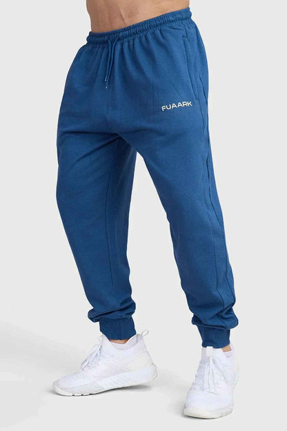 Navy Signature Oversized Joggers by Fuaark Nz, relaxed fit with elastic waistband and cuffed ankles, soft and comfortable fabric.