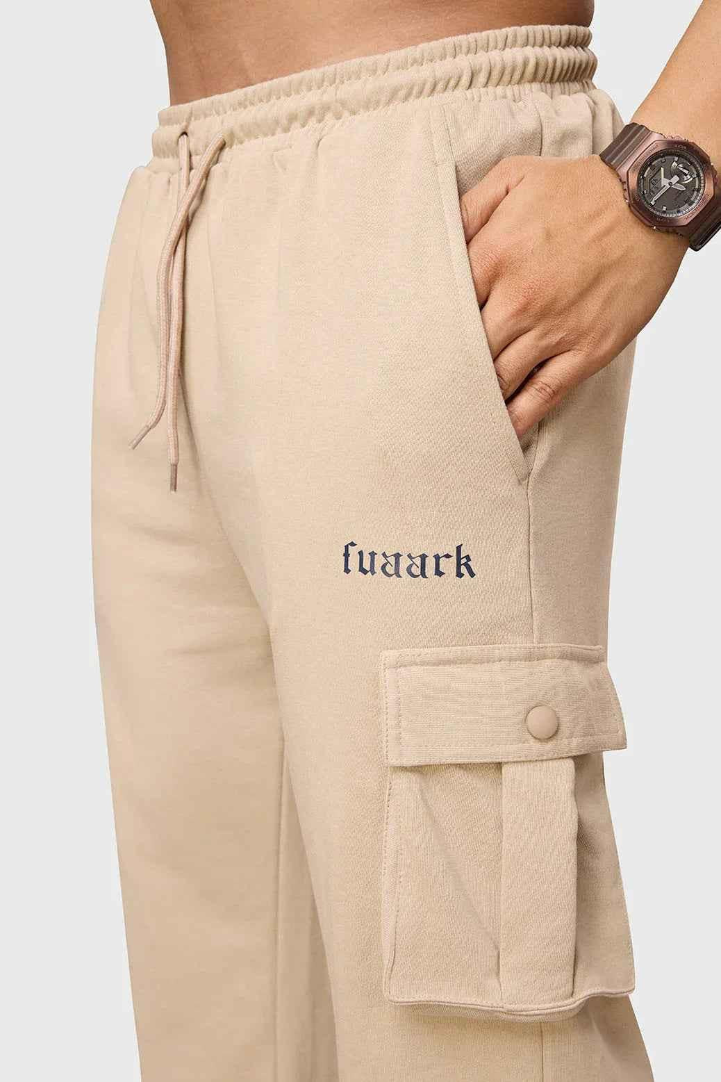 Beige Fuaark Nz Pinnacle Pocket Pants joggers with side pockets, shown in XS size, casual and comfortable for everyday wear.