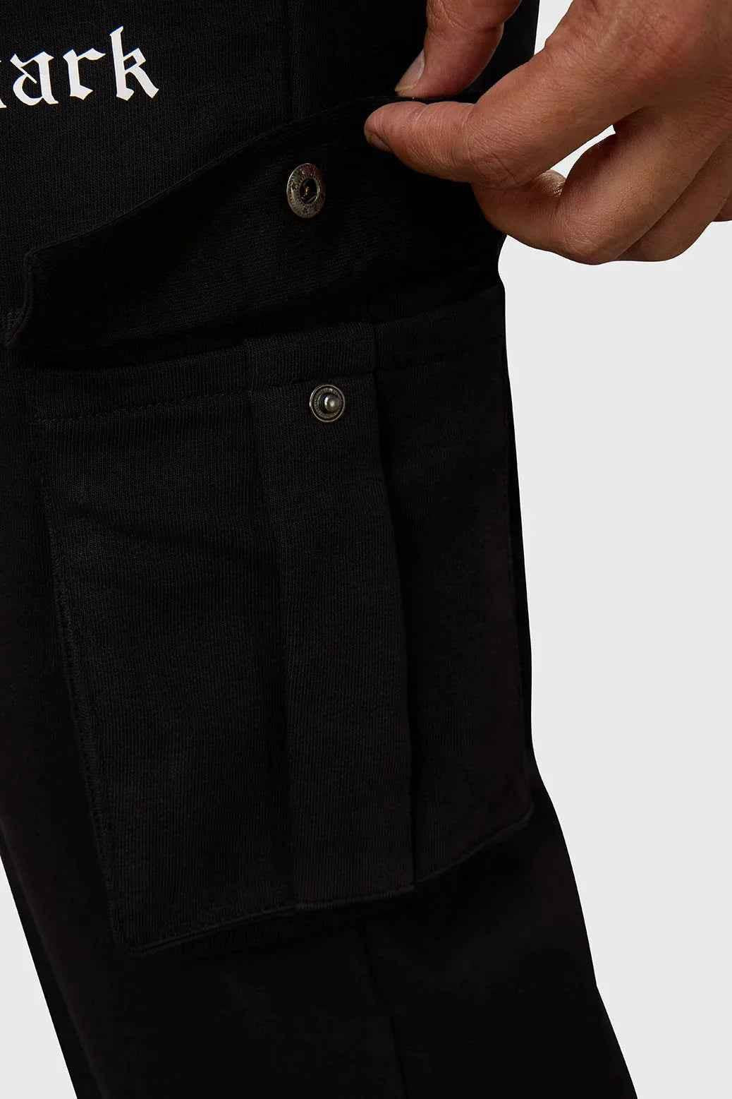 Black Pinnacle Pocket Pants joggers by Fuaark Nz, featuring a relaxed fit and functional pockets, visible in the image.