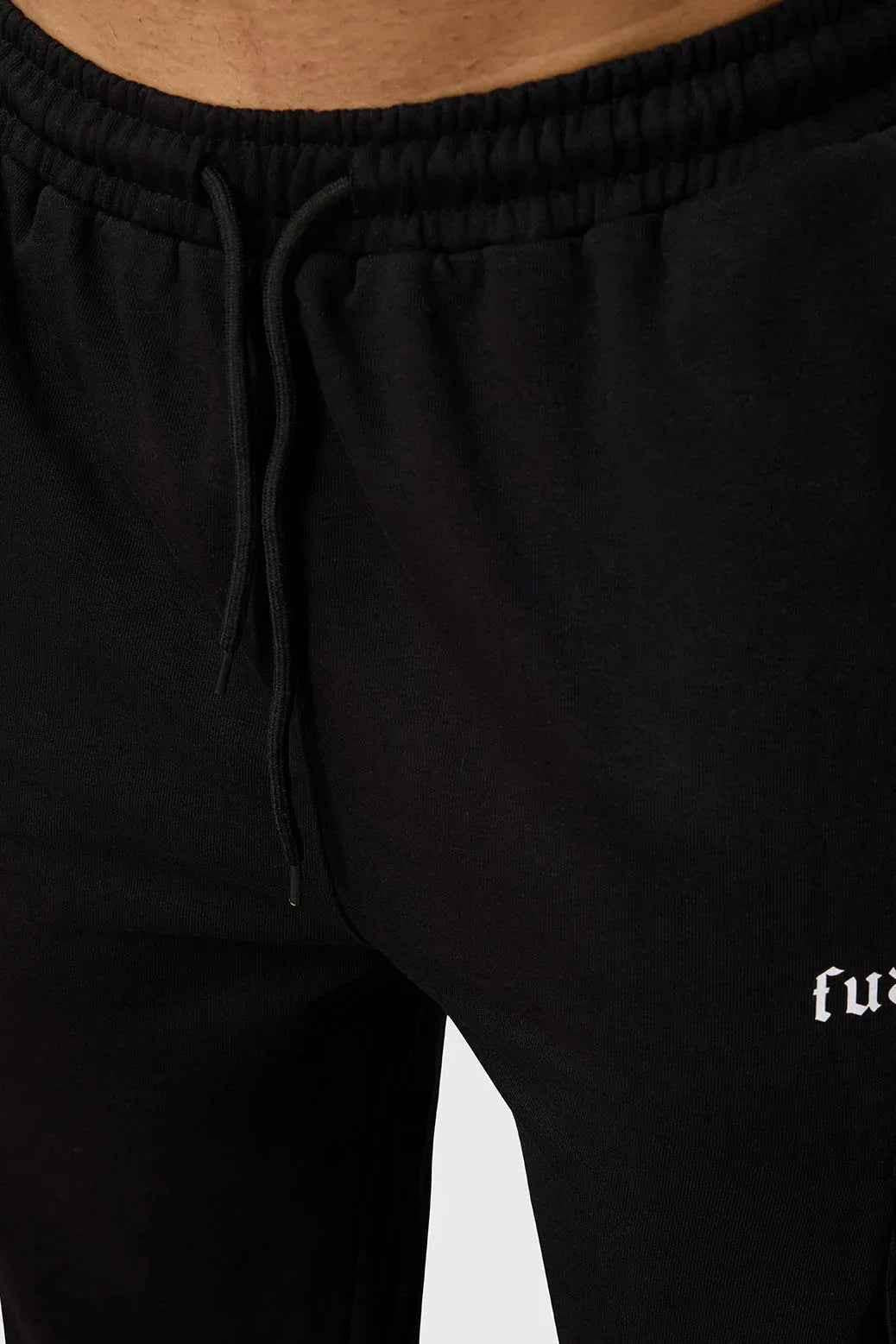 Black Fuaark Nz Pinnacle Pocket Pants joggers with side pockets, slim fit, and comfortable fabric.
