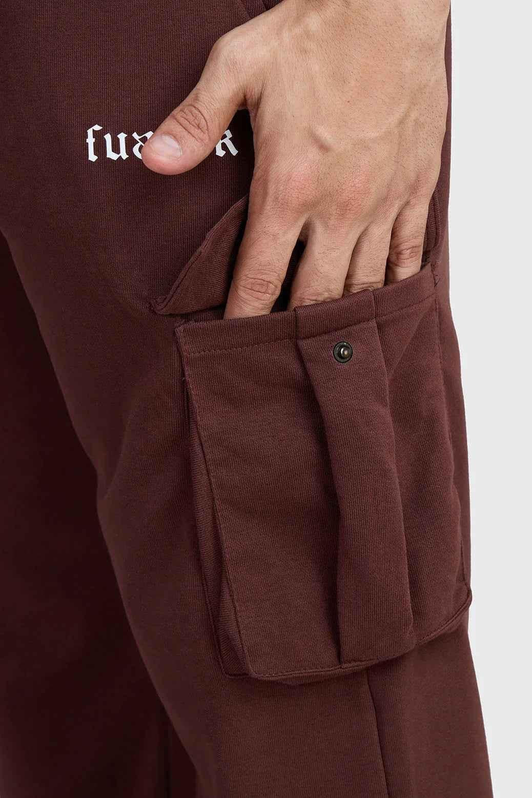 Brown Pinnacle Pocket Pants joggers by Fuaark Nz, featuring a comfortable fit and practical pockets, shown in this image.