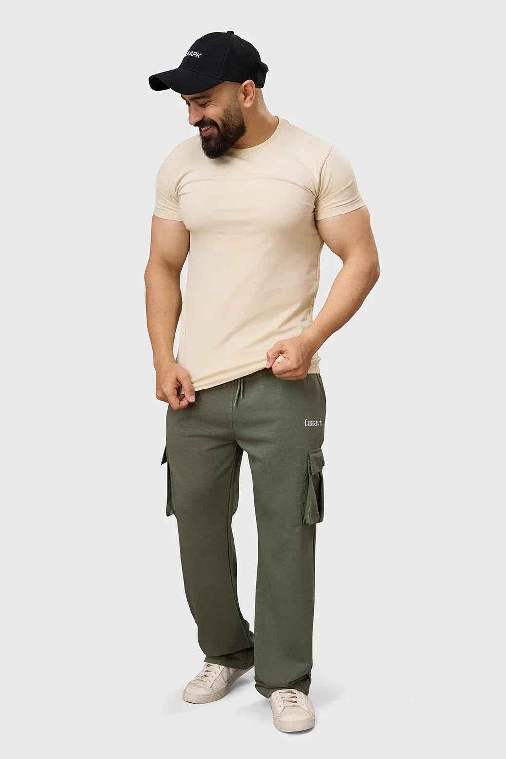 Fuaark Nz Pinnacle Pocket Pants olive green joggers with side pockets, slim fit, casual style, shown on a model.