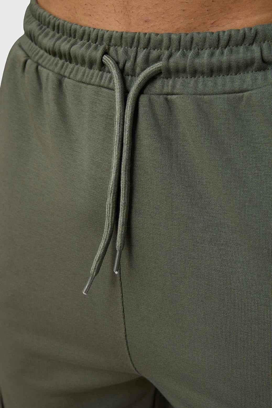 Olive Pinnacle Pocket Pants joggers by Fuaark Nz featuring side pockets and a relaxed fit, displayed on a neutral background.