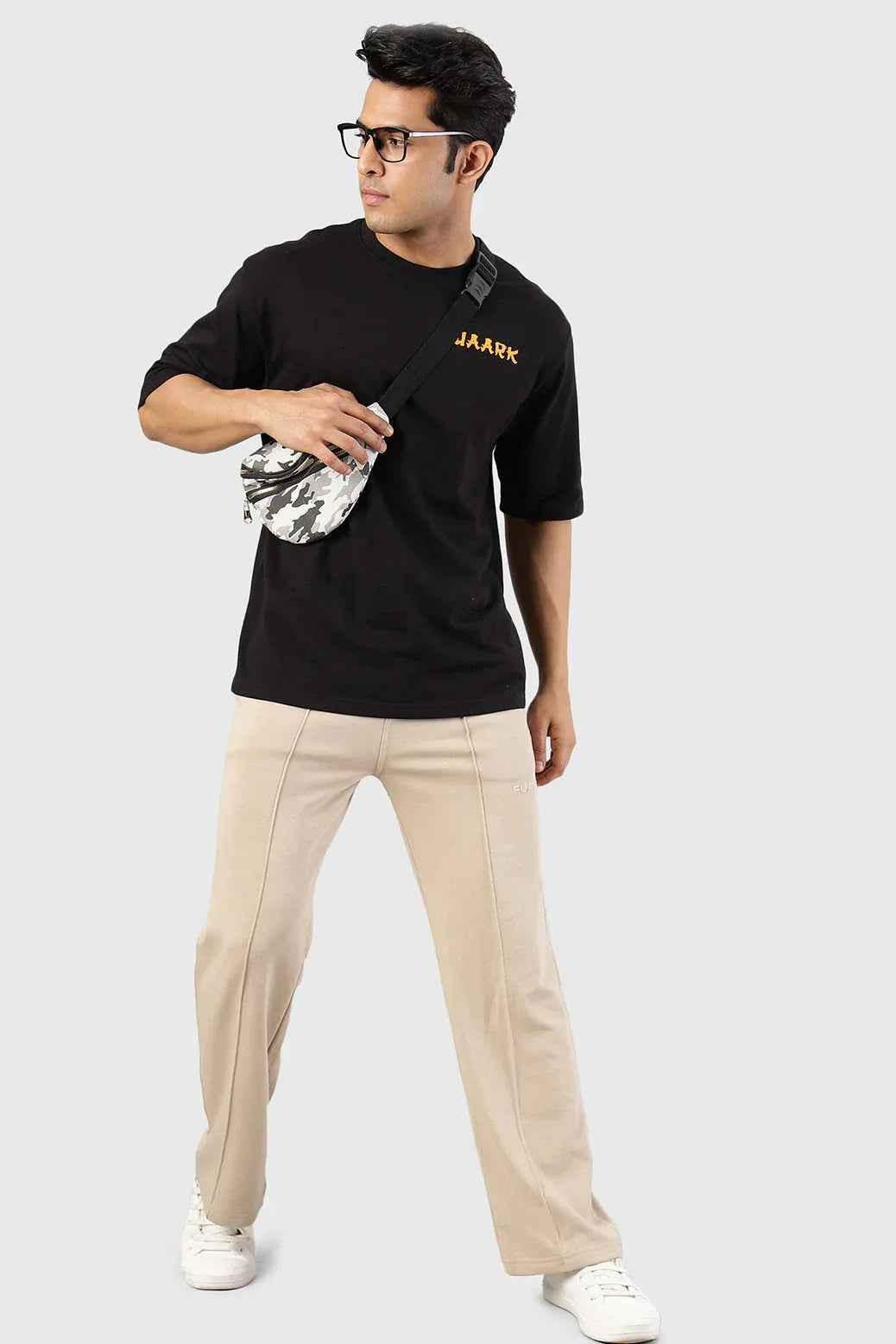 Fuaark Nz Pinnacle Straight Pants beige joggers, slim fit with a comfortable design, shown on a model.
