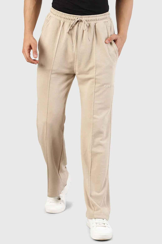 Fuaark Nz Pinnacle Straight Pants beige joggers laid flat, showcasing the comfortable fit and sleek design.