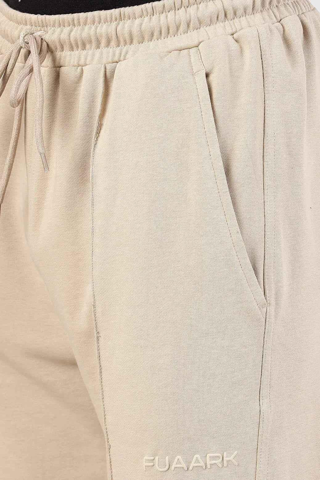 Beige Pinnacle Straight Pants joggers by Fuaark Nz, showing the fit and fabric detail of the casual straight-leg style.