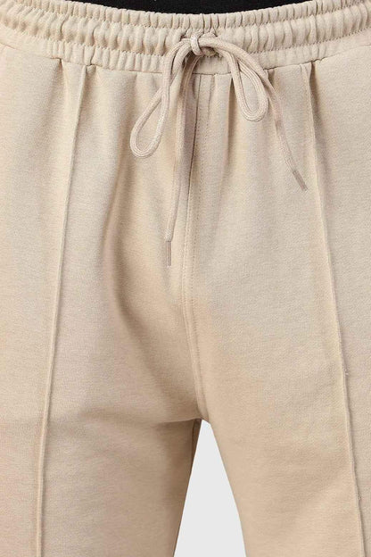 Beige Pinnacle Straight Pants joggers by Fuaark Nz, featuring a relaxed fit and casual style, shown on a model.
