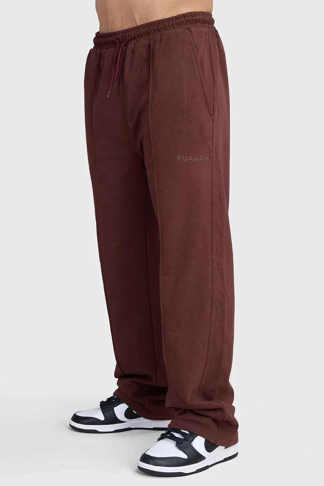 Fuaark Nz Pinnacle Straight Pants in brown, casual joggers with a relaxed fit, shown on a model.