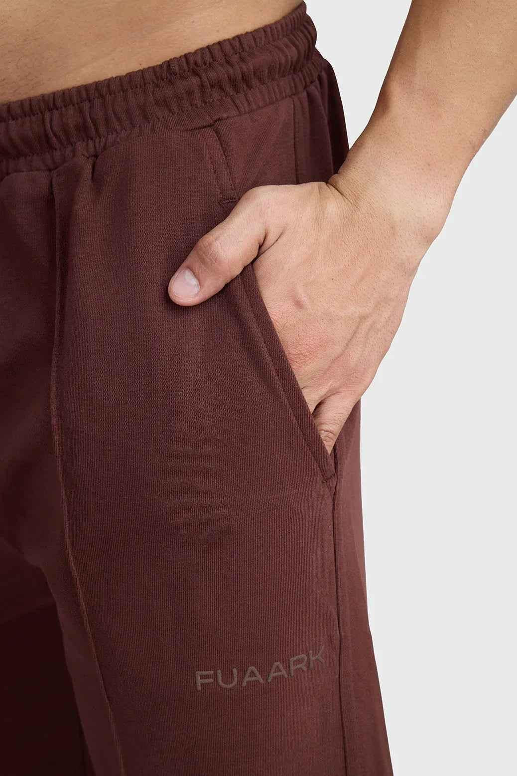 Fuaark Nz Pinnacle Straight Joggers in brown, slim-fit pants with a casual style, shown in XS size.