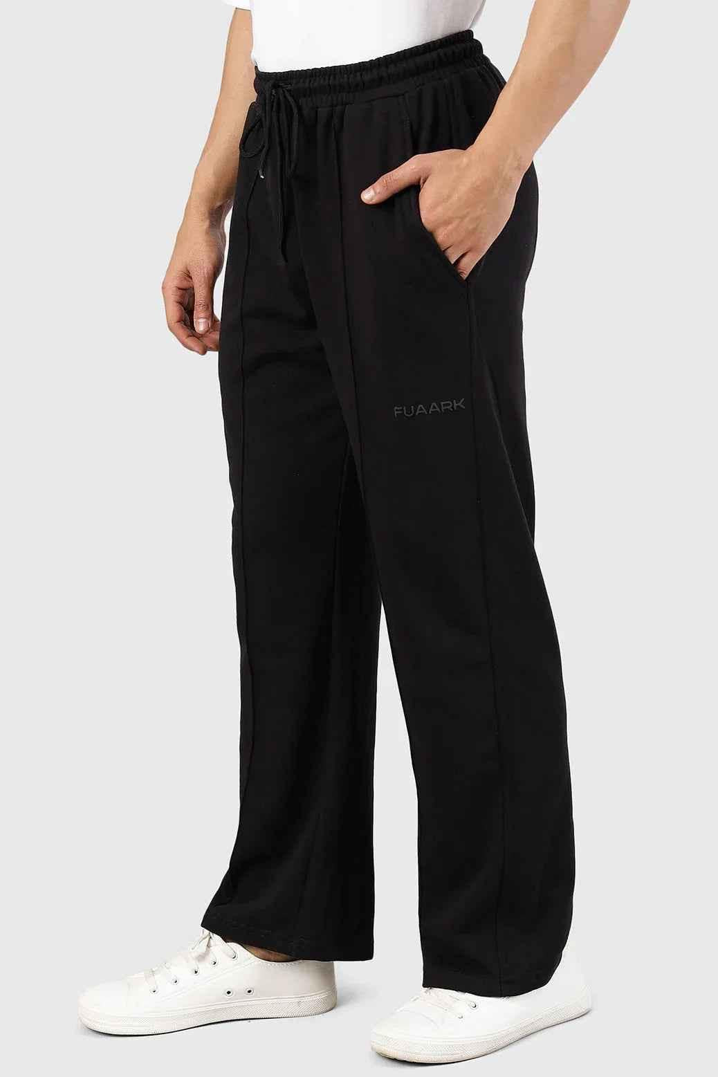 Fuaark NZ Pinnacle black straight leg pants with oversized fit and 2-way stretch, shown on a model.