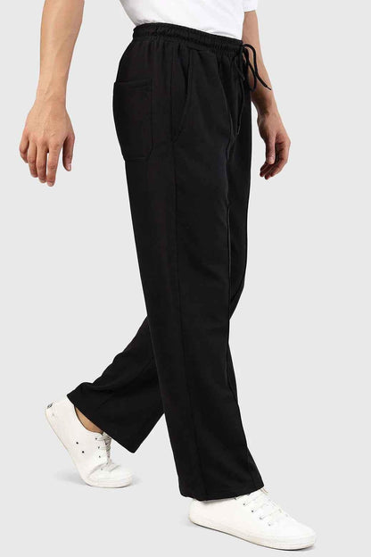 Fuaark Nz Pinnacle black straight-leg pants with oversized fit and 2-way stretch, shown on a model.