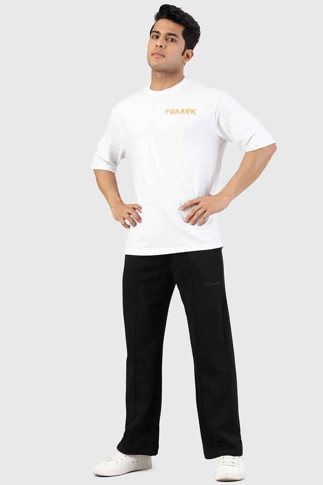Fuaark Nz Pinnacle black straight-leg pants with oversized fit and 2-way stretch, shown on a model in a casual setting.