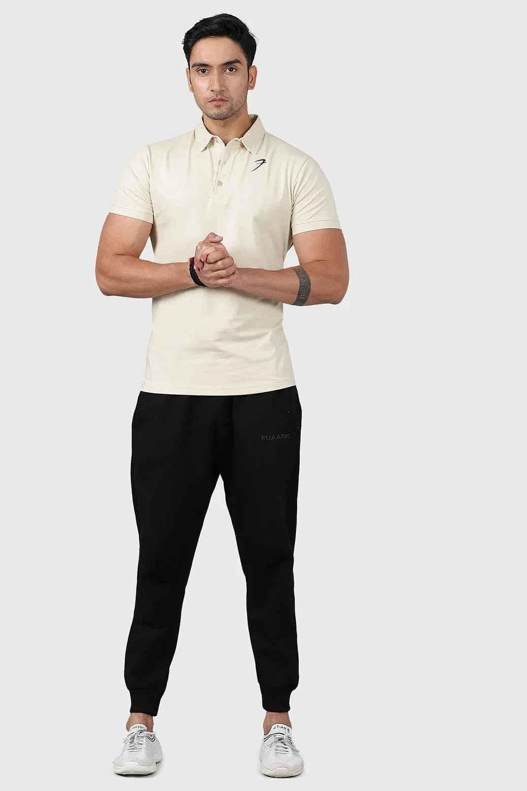 Beige Polo T-shirt by Fuaark Nz, men's casual short-sleeve polo with collar and button placket, laid flat on a white background.