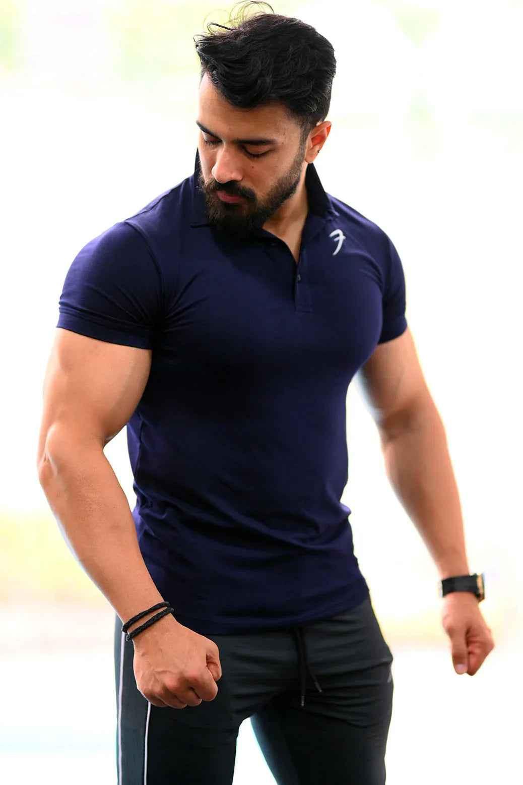 Navy Polo T-shirt from Fuaark Nz featuring a classic collar and short sleeves, displayed flat on a white background.
