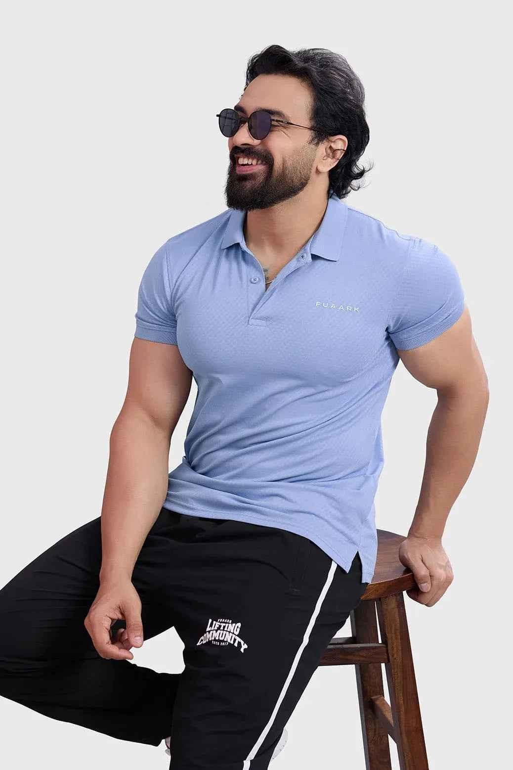 Light blue Wave Polo T-shirt by Fuaark Nz, featuring a classic polo design and comfortable fit.