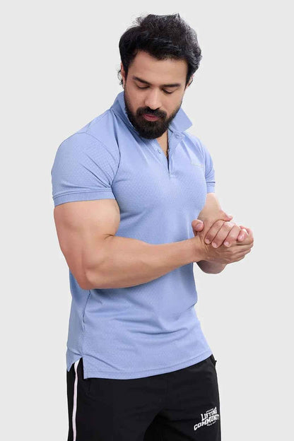 Light blue Wave Polo T-shirt by Fuaark Nz, featuring a classic polo collar and subtle wave design on the front.