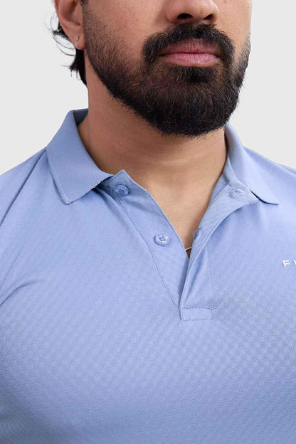 Light blue Wave Polo T-shirt by Fuaark Nz, showcasing a classic polo design with a subtle wave pattern and collar.