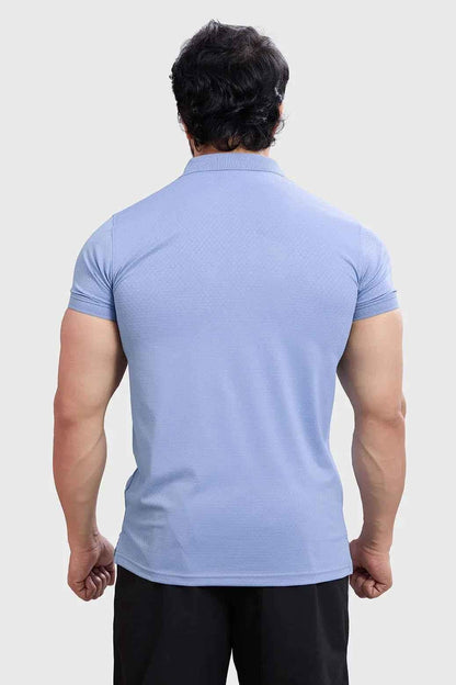 Light blue Wave Polo T-shirt by Fuaark Nz featuring a classic polo collar and subtle wave design.