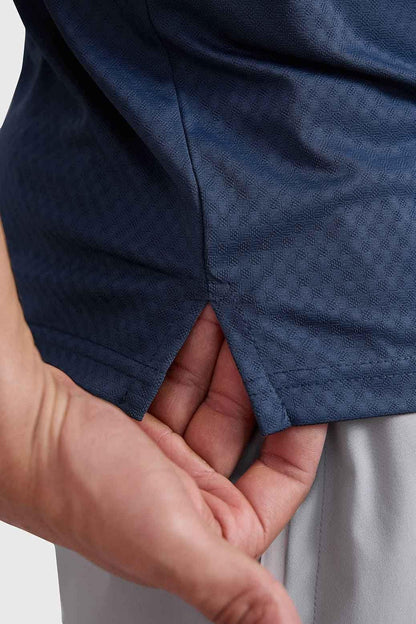 Navy Wave Polo T-shirt by Fuaark NZ, featuring a classic polo collar and short sleeves, casual men's apparel.