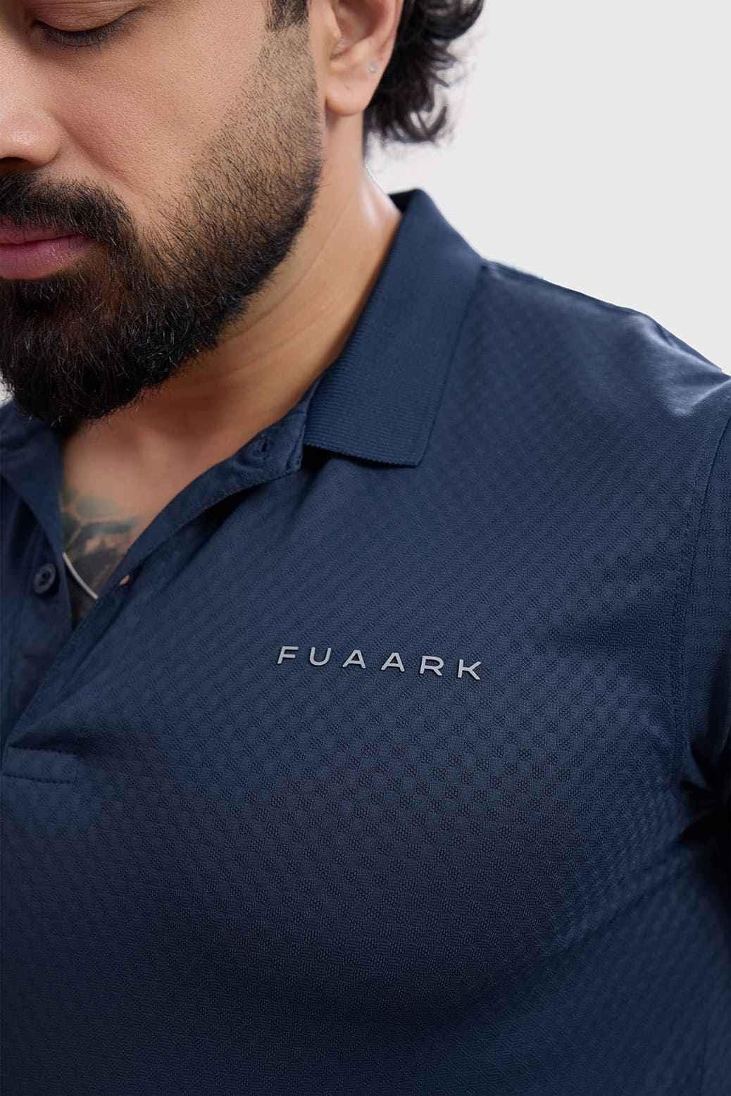 Navy Wave Polo T-shirt by Fuaark Nz featuring a classic polo collar and subtle wave design on soft fabric.