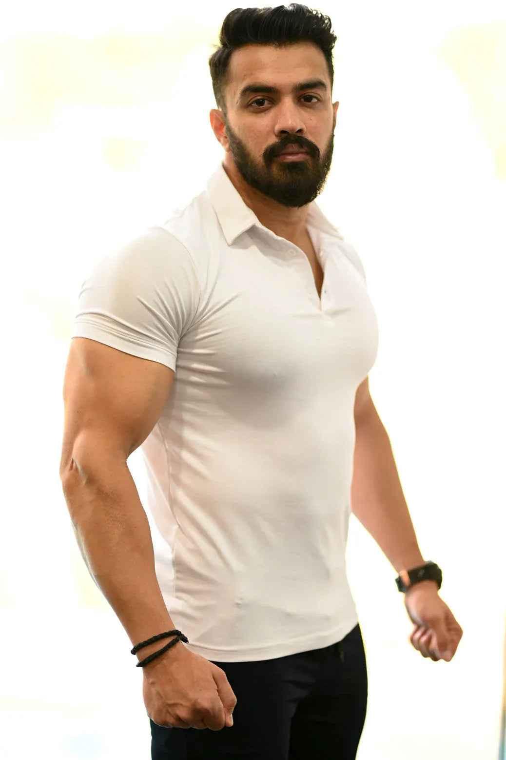 White Polo T-Shirt by Fuaark Nz, showcasing a classic polo shirt with a comfortable fit and stylish design.
