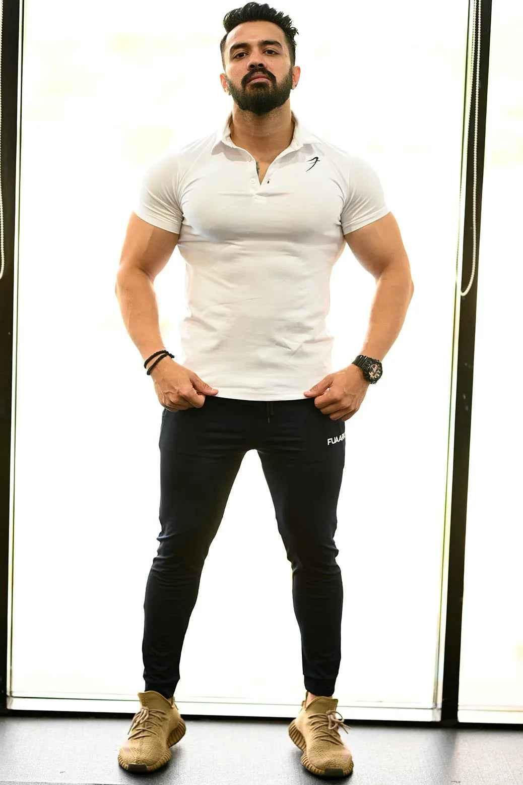 White Fuaark Nz polo shirt for men, featuring a classic fit and soft cotton fabric for effortless style and comfort.