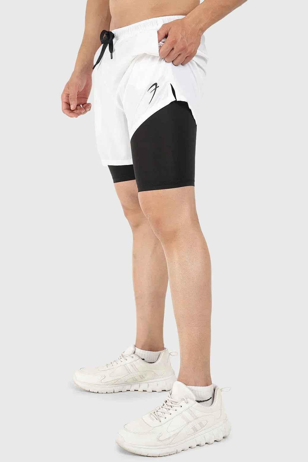 White 2-in-1 5-inch compression shorts by Fuaark Nz, featuring a snug fit and flexible design for active wear.