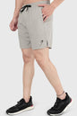 Fuaark Nz 2-in-1 beige compression shorts showing a close-up of the fitted, stretchy fabric and elastic waistband.