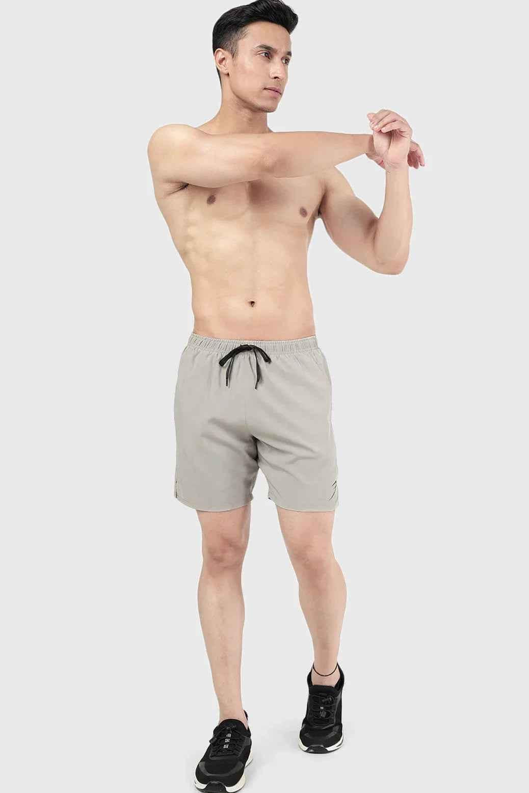 Beige 2-in-1 compression shorts by Fuaark Nz featuring a snug fit and stretchy fabric for active wear and support.