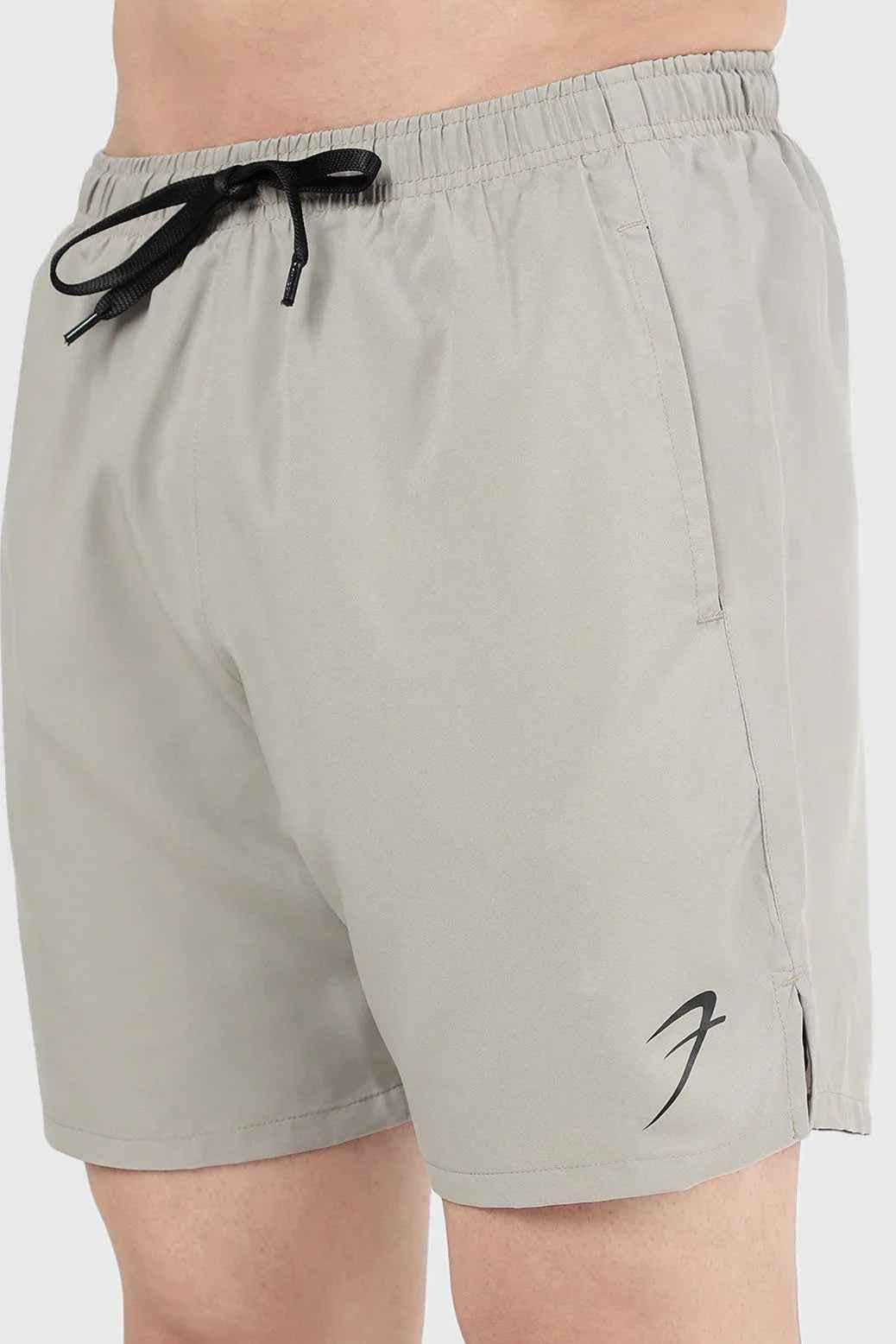 Beige 2-in-1 compression shorts by Fuaark Nz, shown with stretch fabric and fitted design for athletic support and comfort.