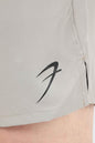 Beige 2-in-1 compression shorts by Fuaark NZ, featuring a snug fit and elastic waistband for active wear and support.