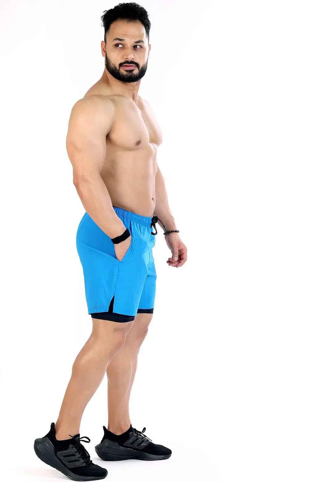Blue 2-in-1 compression shorts by Fuaark NZ featuring flexible fabric and athletic fit for active wear.