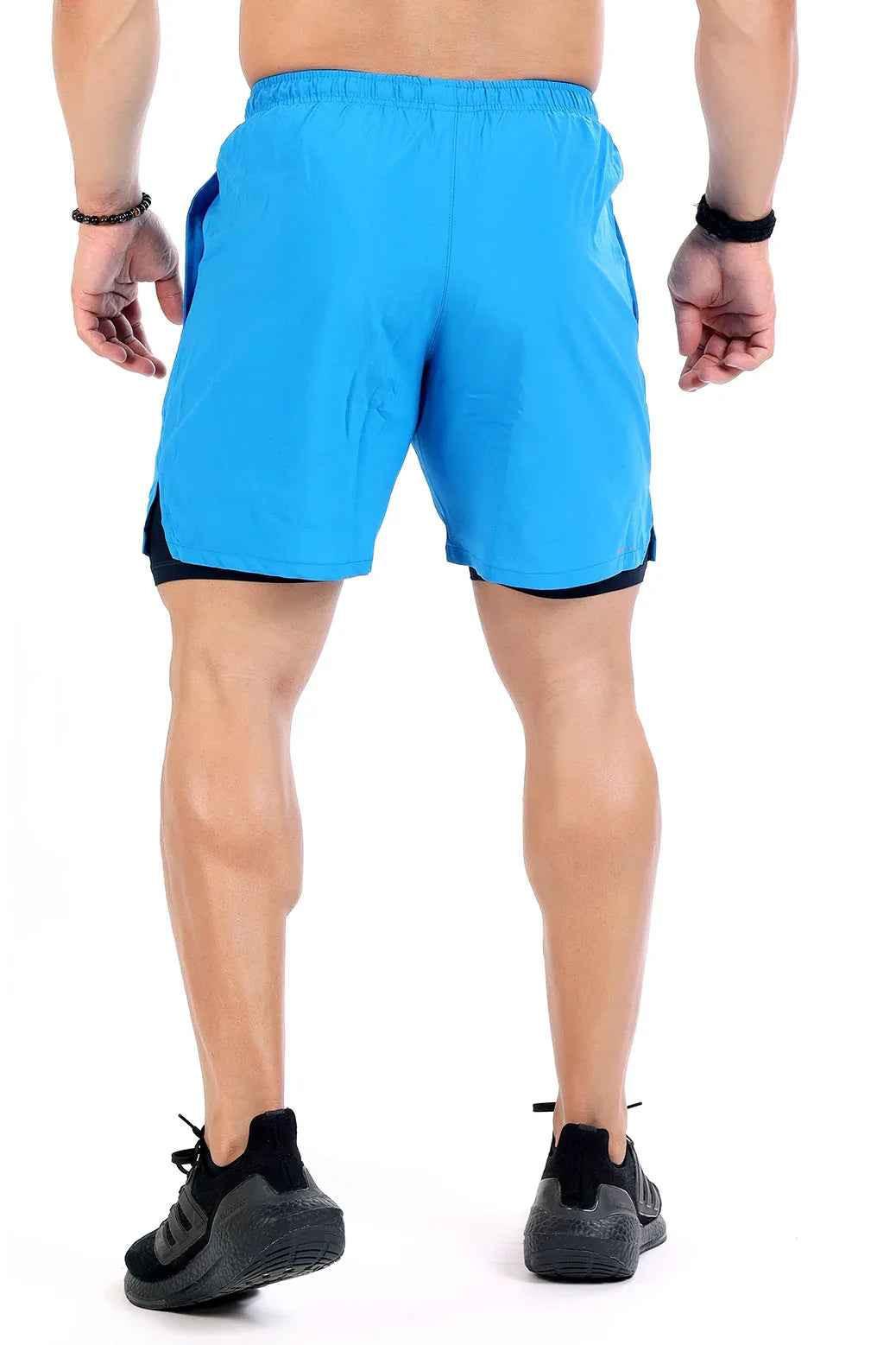 Blue 2 in 1 compression shorts by Fuaark Nz featuring breathable fabric and athletic fit for active wear.