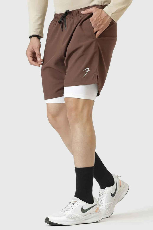 Brown 2-in-1 compression shorts by Fuaark NZ, featuring stretch fabric and athletic fit for active wear.