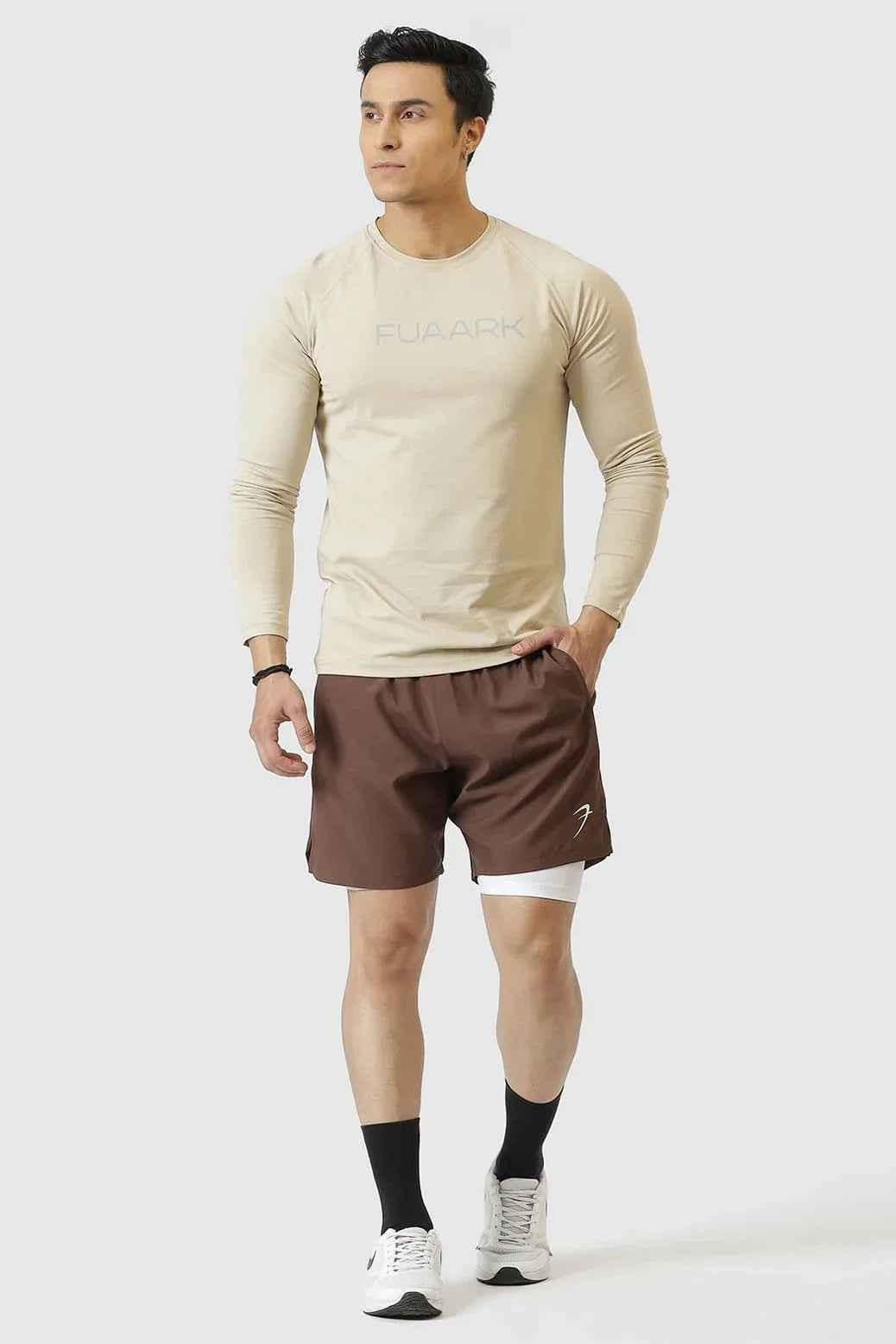 Fuaark Nz 2-in-1 compression shorts in brown, showing a close-up of the stretchy, form-fitting fabric design.