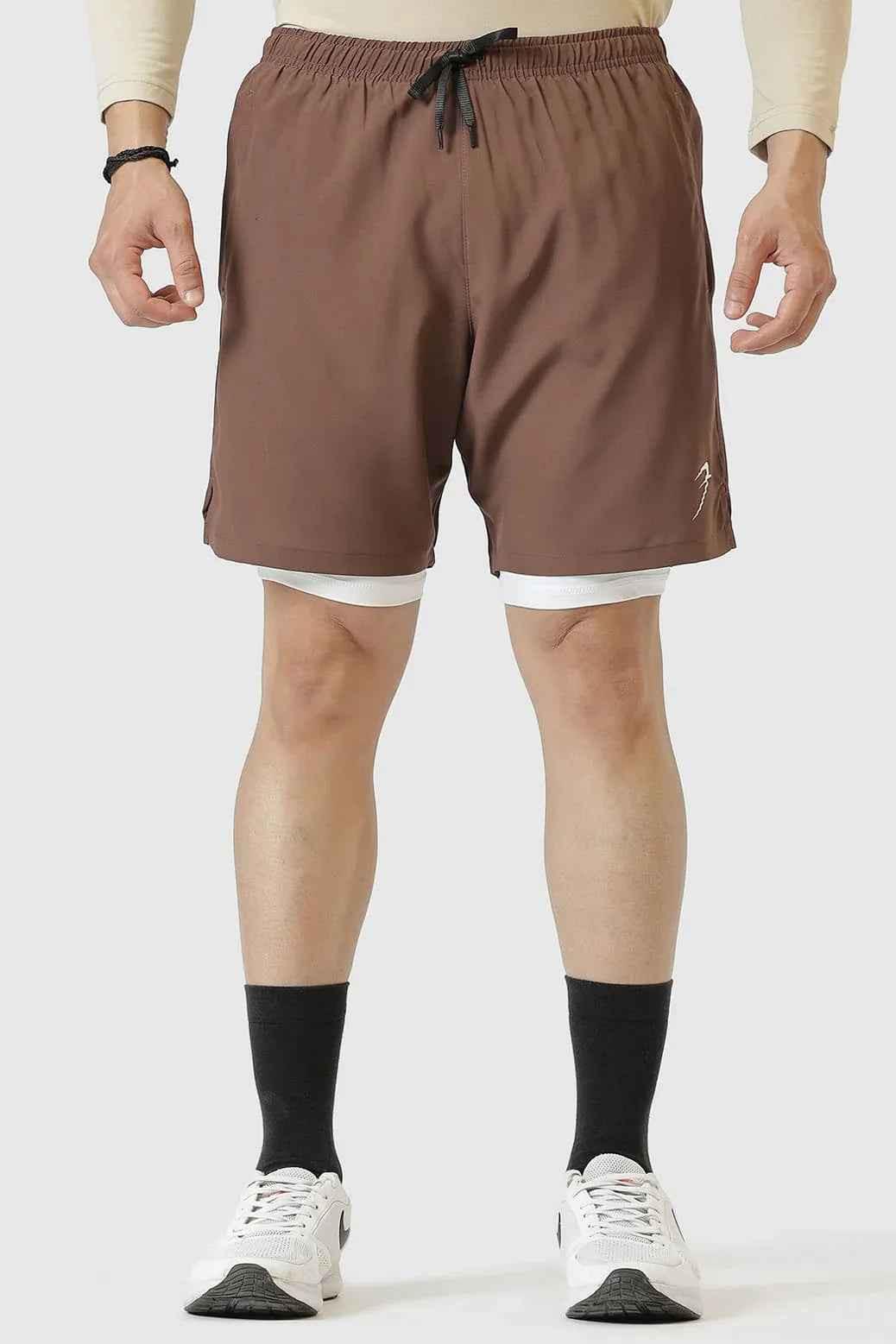 Brown 2-in-1 compression shorts by Fuaark Nz featuring a fitted design and stretchable fabric for athletic performance and comfort.
