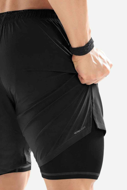 Fuaark Nz 2-in-1 compression shorts in dark grey, close-up of lightweight, stretchy fabric with waistband and shorts design.