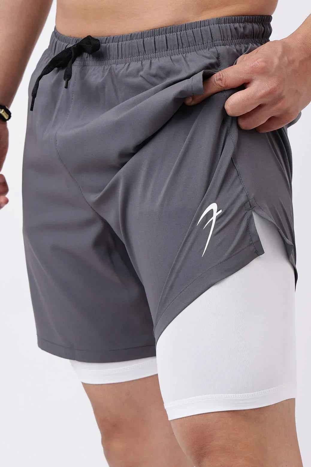 Fuaark Nz 2-in-1 compression shorts in grey with white accents, fitted design for athletic performance and comfort.