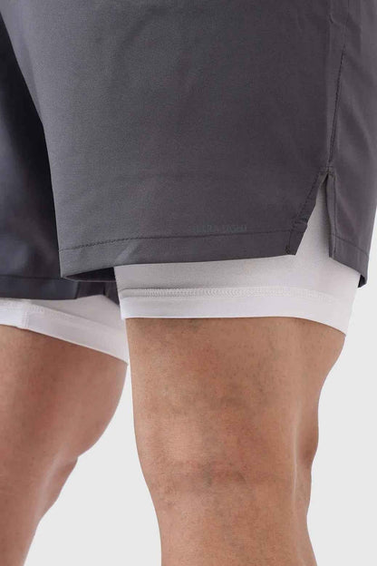 Fuaark Nz 2-in-1 compression shorts in grey with white accents, designed for athletic performance and comfort.