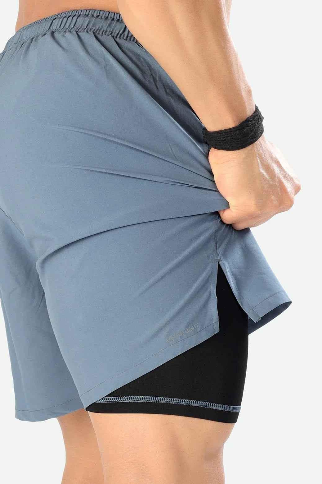 Light grey 2-in-1 compression shorts by Fuaark Nz, featuring a fitted design and athletic style for active wear.