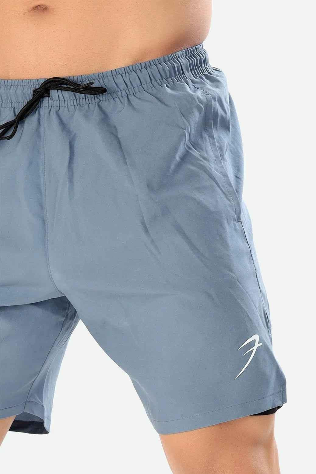 Light grey 2 in 1 compression shorts by Fuaark Nz featuring a snug fit and breathable fabric for active wear.