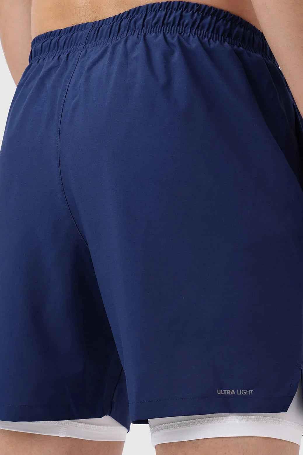 Navy 2-in-1 compression shorts by Fuaark Nz with fitted design and stretch fabric for athletic performance.