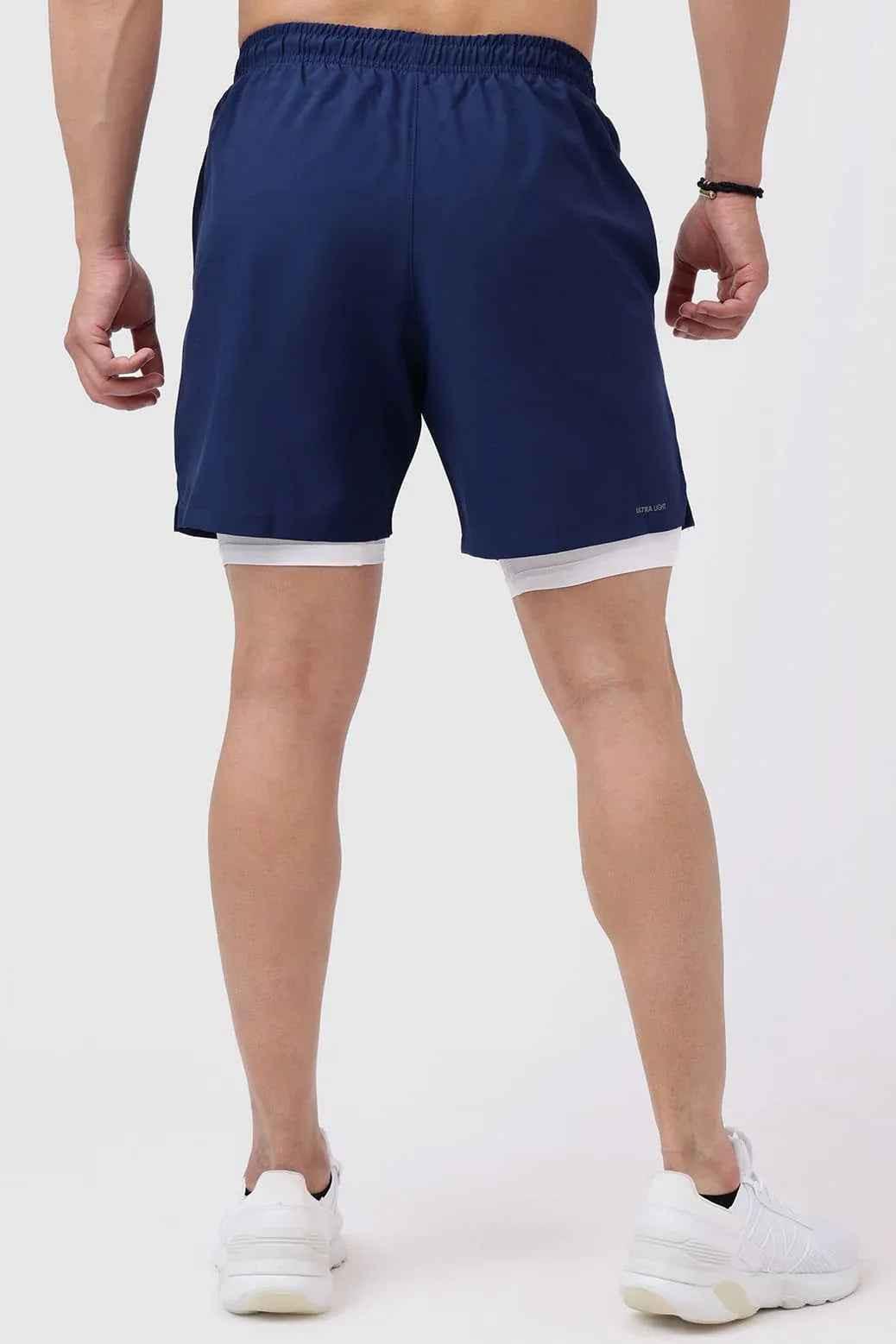 Navy 2-in-1 compression shorts by Fuaark Nz, featuring a sleek, fitted design with elastic waistband and breathable fabric.