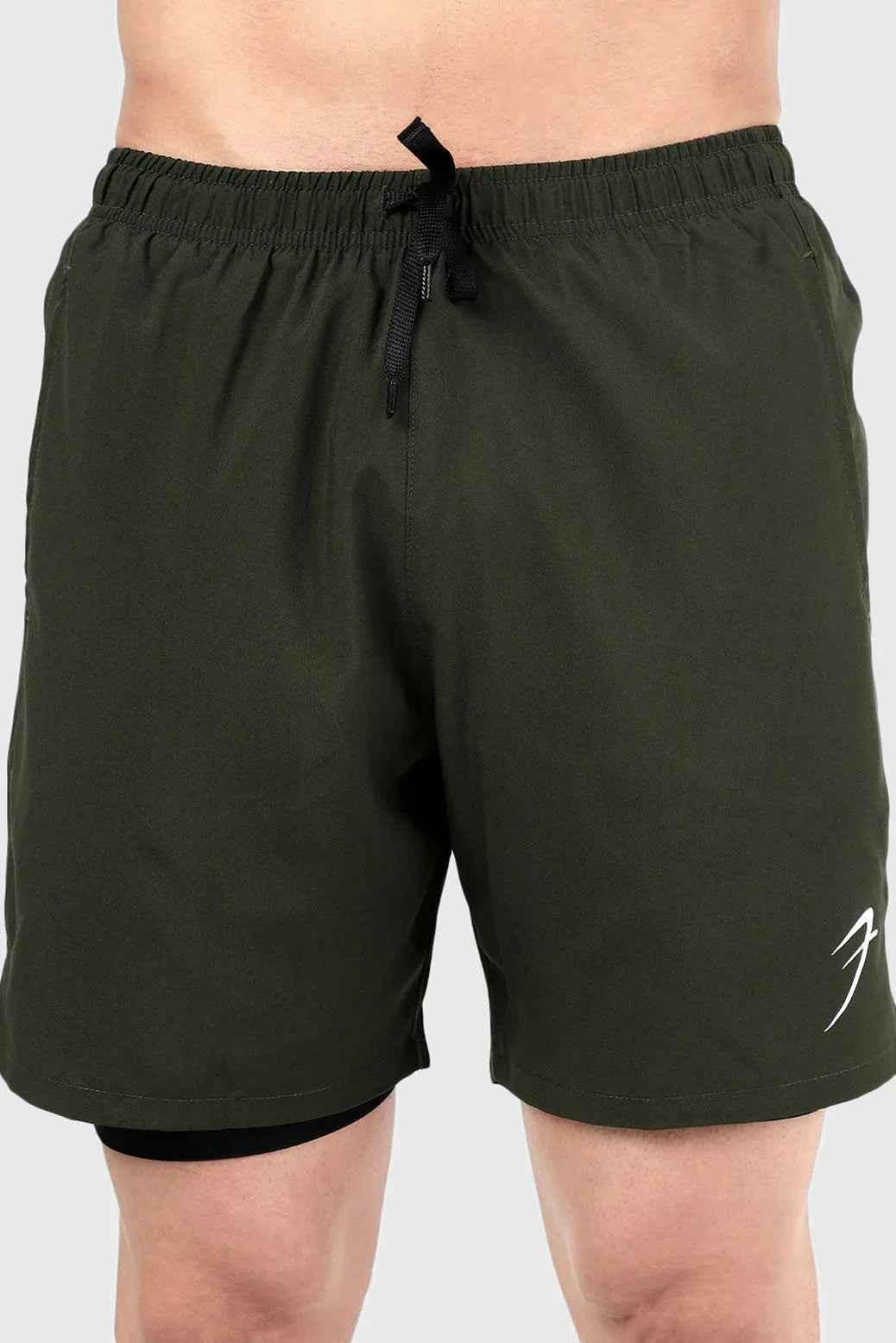 Fuaark NZ 2-in-1 compression shorts in olive color, designed for comfort and performance, shown on a model.