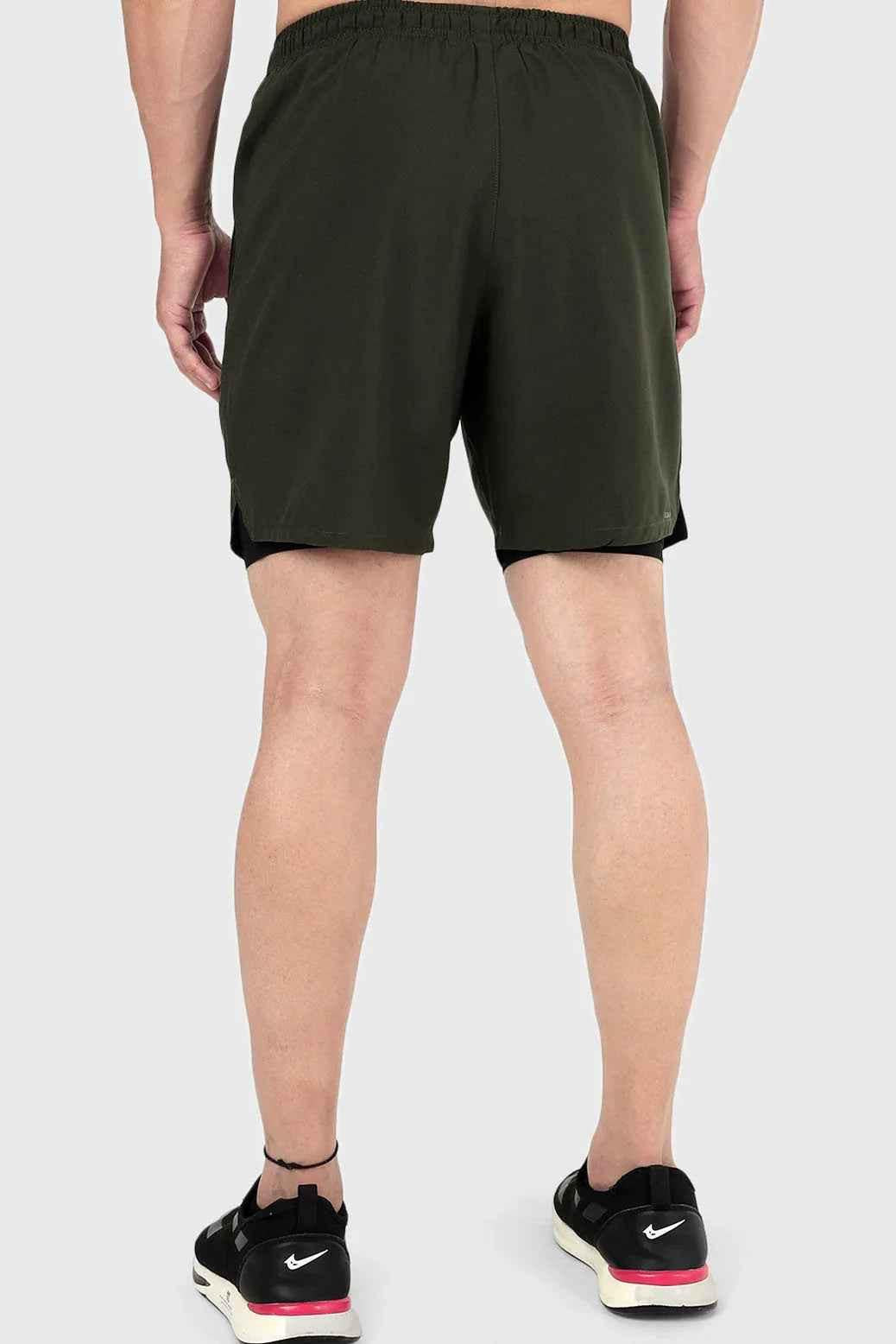 Fuaark Nz 2-in-1 olive compression shorts for men, designed for comfort and high performance during workouts or sports.