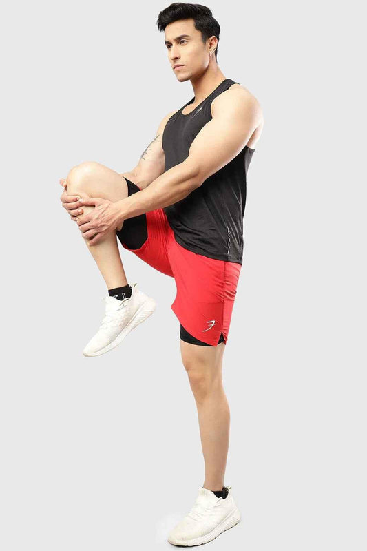Red 2 in 1 compression shorts by Fuaark Nz, featuring a snug fit and athletic design for active wear.