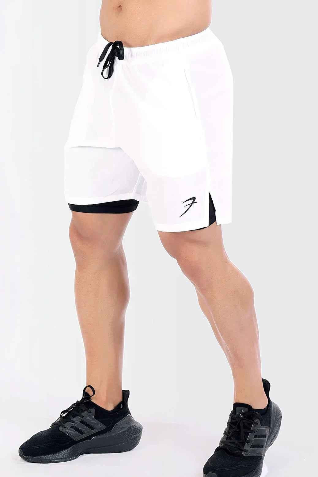 White 2-in-1 compression shorts by Fuaark Nz featuring a sleek design and comfortable fit for active wear.