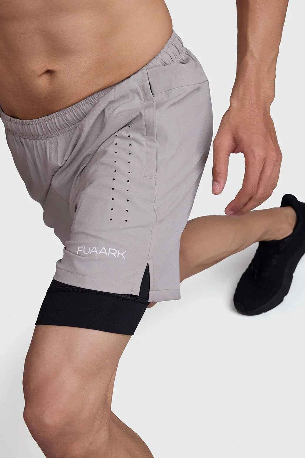 Fuaark Nz 2-in-1 laser shorts in beige with black accents, featuring a stylish and versatile design for casual wear.